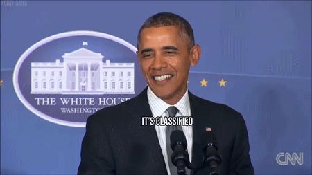 Former President Obama smiles and says "it's classified"