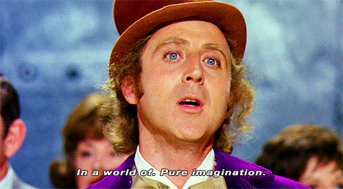 Willy Wonka, a white man in a brown top hat and purple suit, sings "in a world of pure imagination"